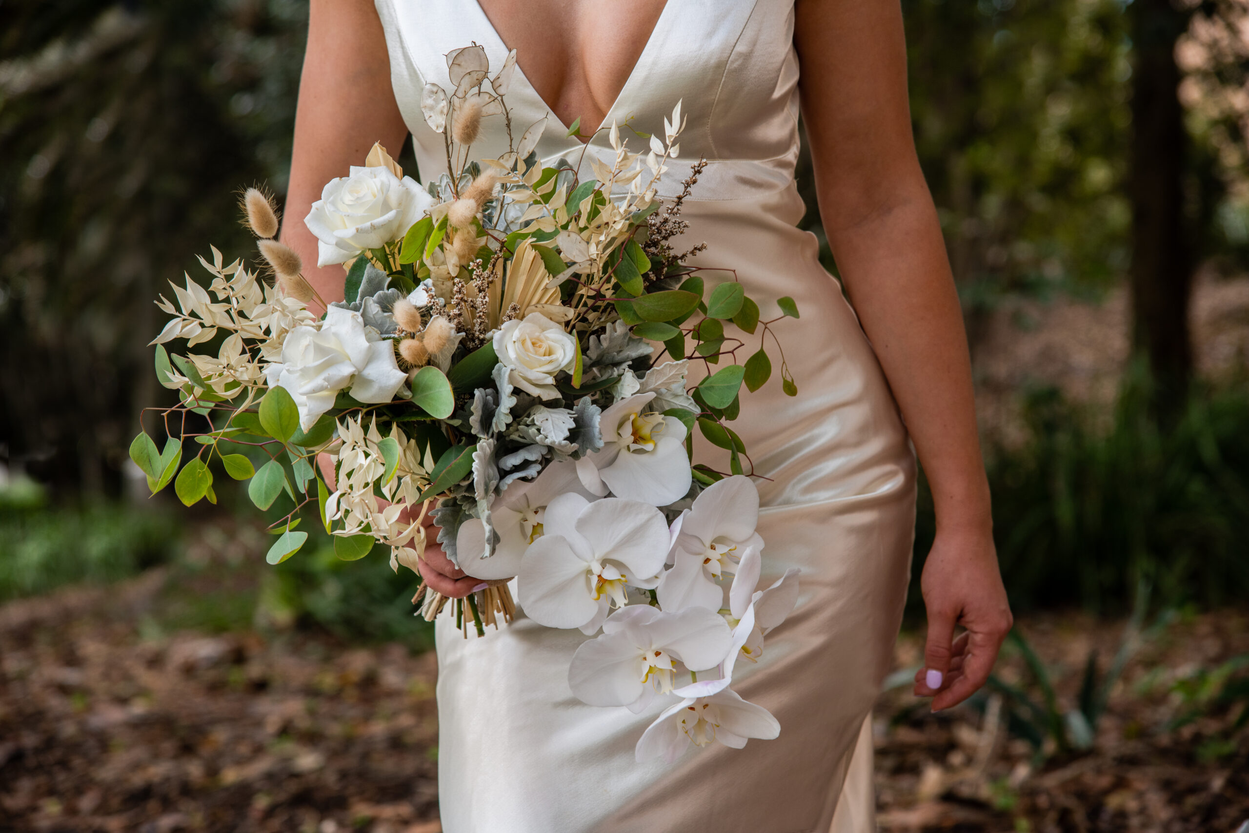 woman holding bouquet of flowers