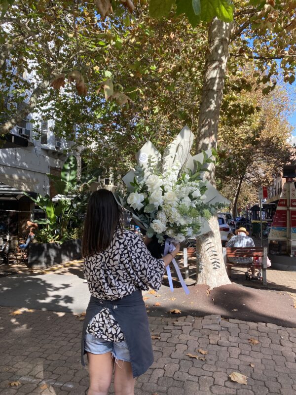 Woman Carrying Flower Bouquet